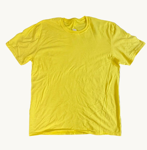Yellow t-shirt on a green textured surface